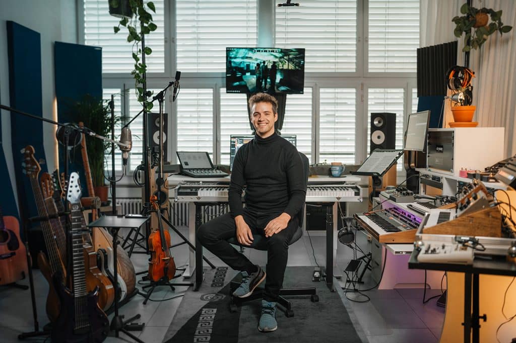 Jakob Eisenbach pictured in his studio alongside the Amphion One18 and Two18